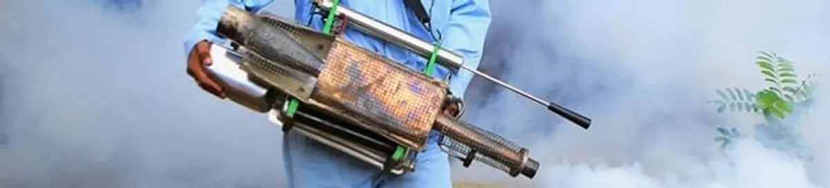 Fumigation technician using a fogger for deep pest treatment in Shreveport, LA